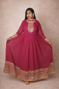 Tomato red colour gown and dupatta.