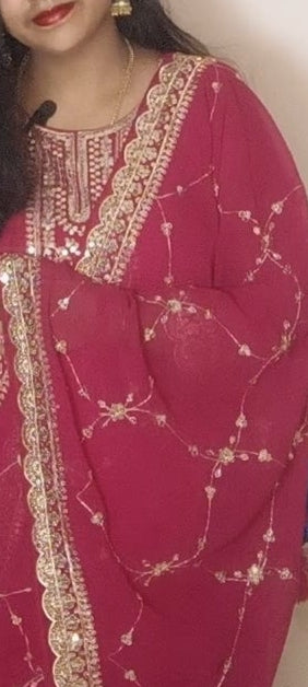 Tomato red colour gown and dupatta.